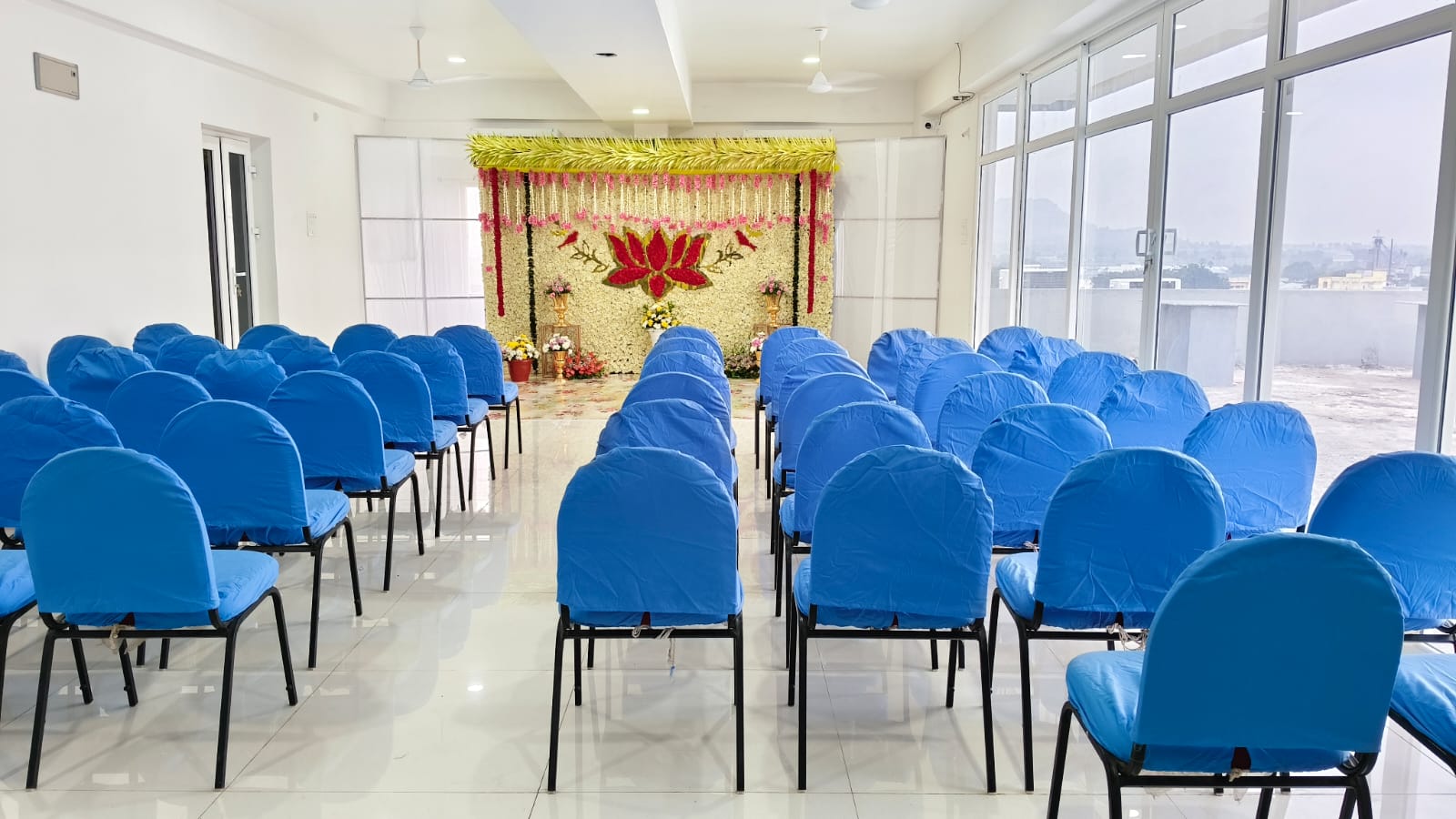 Party Hall with decorated stage and seating arrangement